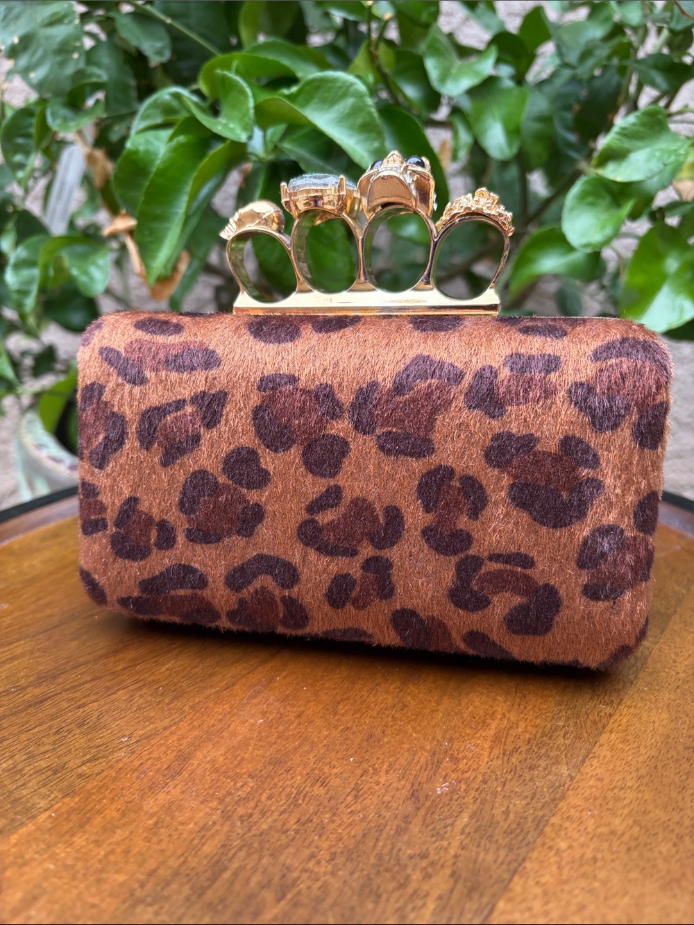 Leopard Print Knuckle-Handle Clutch - Brown synthetic fur.